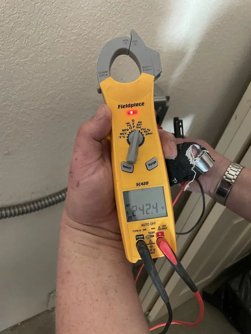 Voltage testing with clamp meter during Recessed Lighting Installation in Upper Moreland